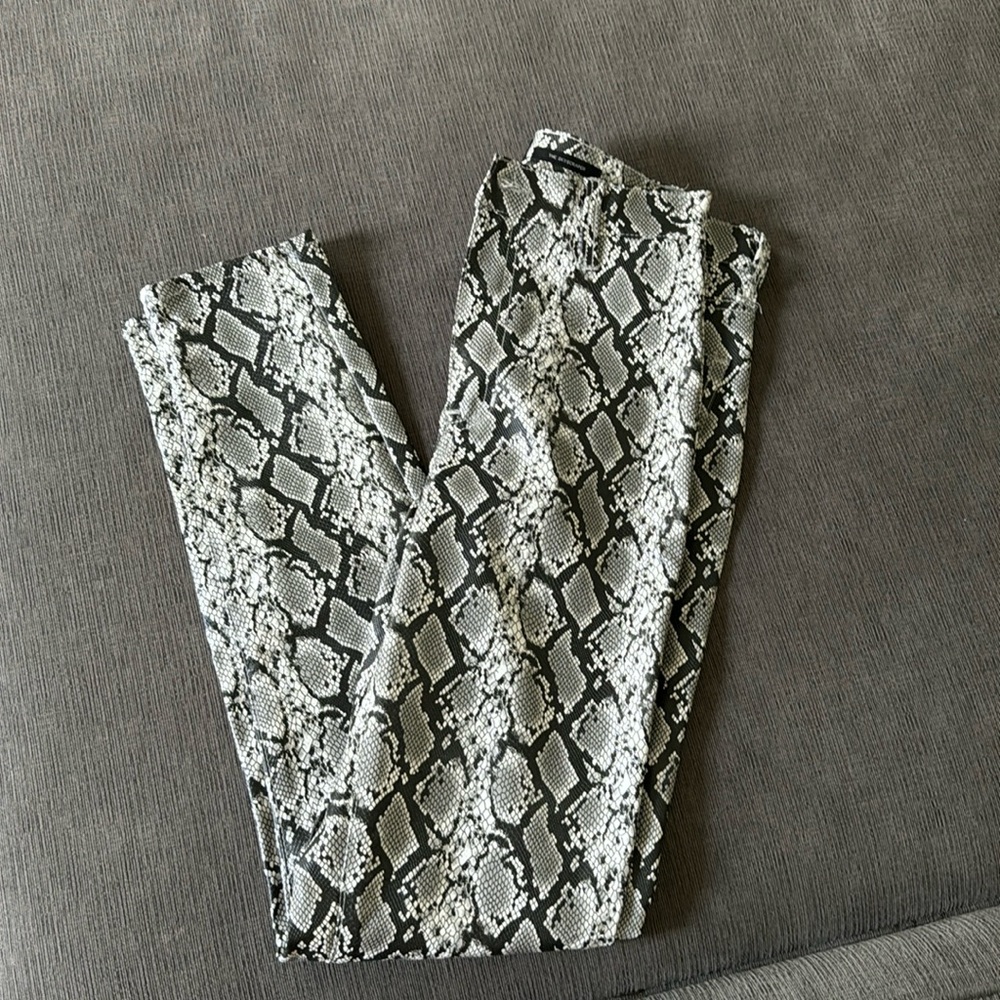 Kendall and Kylie snake faux leather pants. Snug fitting.